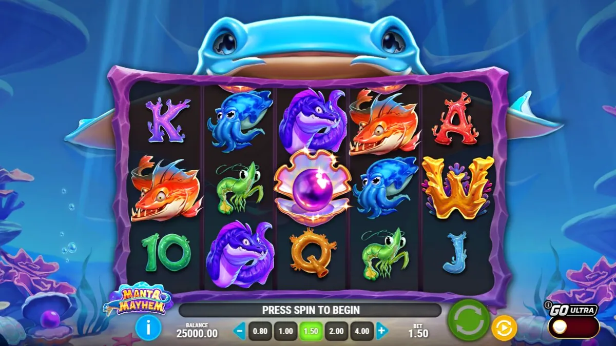 Makulay na underwater theme ng Manta Mayhem slot na may mga coral reef at manta ray.